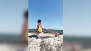 Yoga - a set of exercises for stretching the legs with an elastic band for yoga