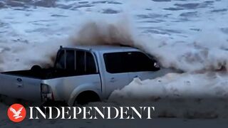 Sea spits mangled 4x4 truck out onto Devon beach following Storm Ciarán